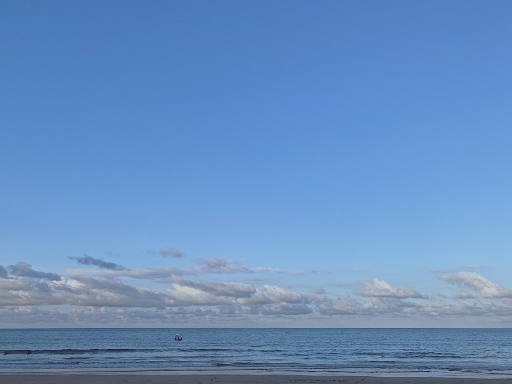 blue sea under blue sky during daytime