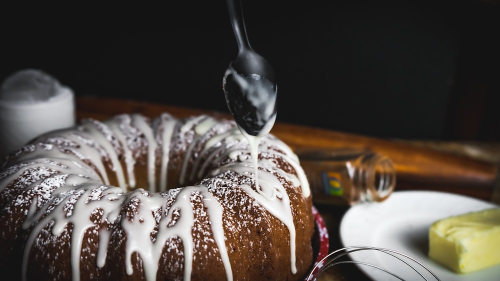 chocolate cake with white icing on top