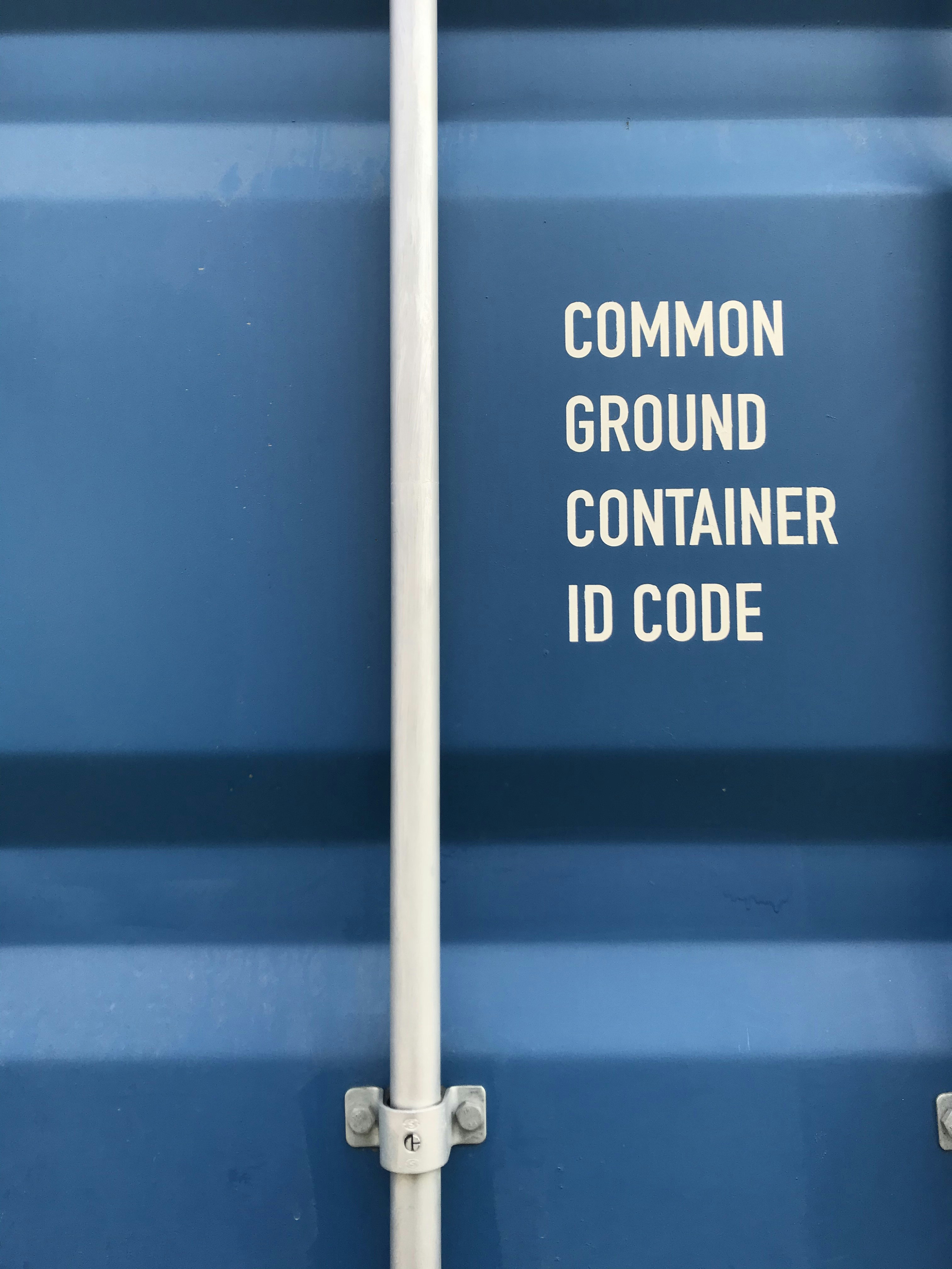 a close up of a metal pole with a sign on it