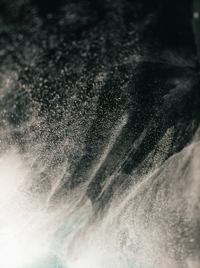 Close-up of swirling mist infused with hints of rare flowers and cosmic elements.