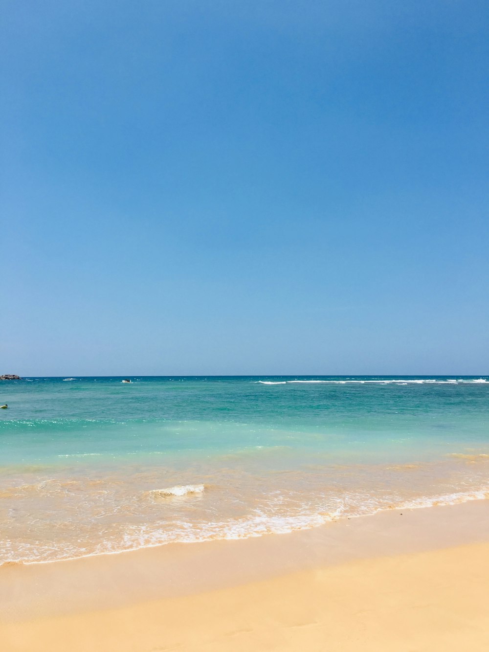 blue sea under blue sky during daytime