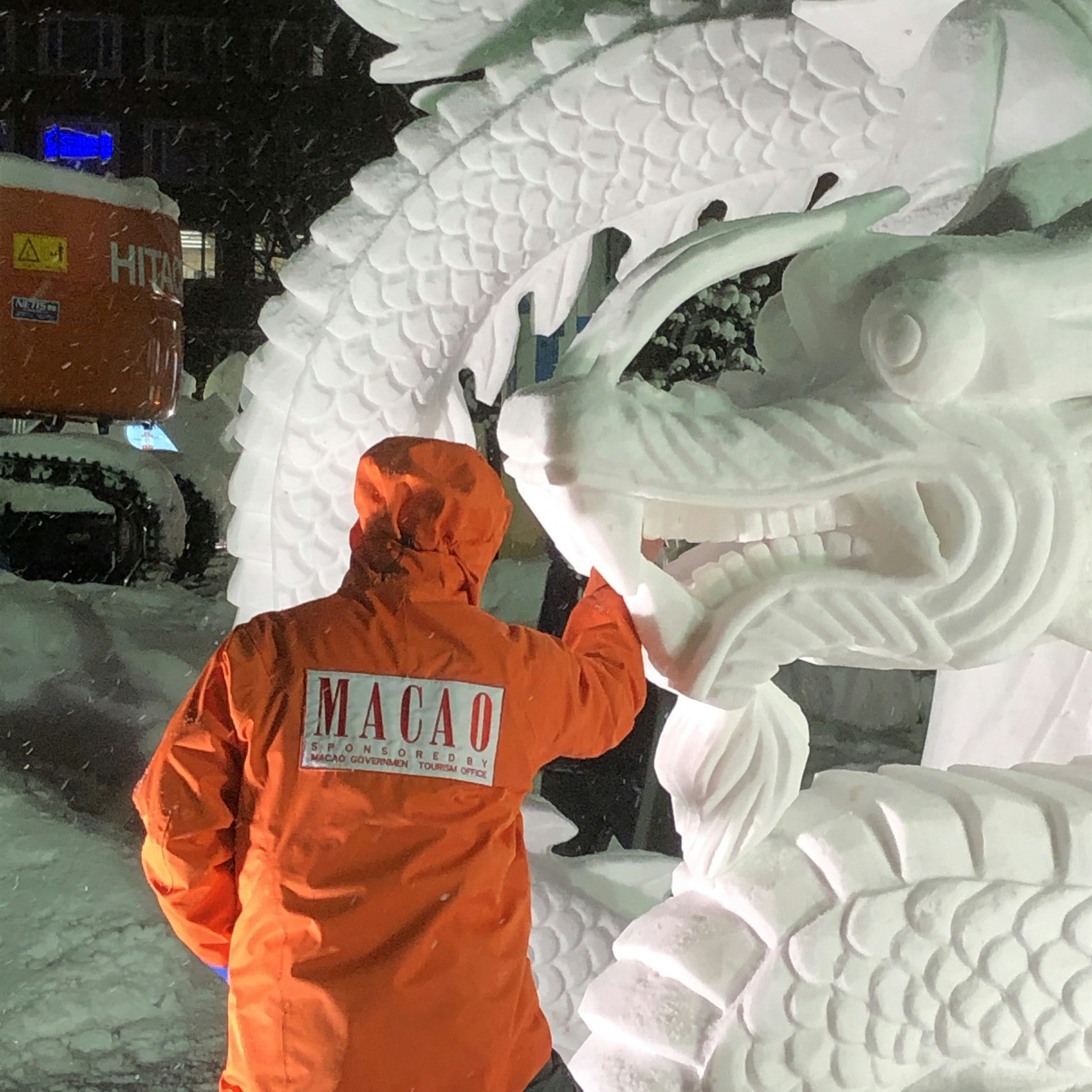 Snow art installations illuminated at night