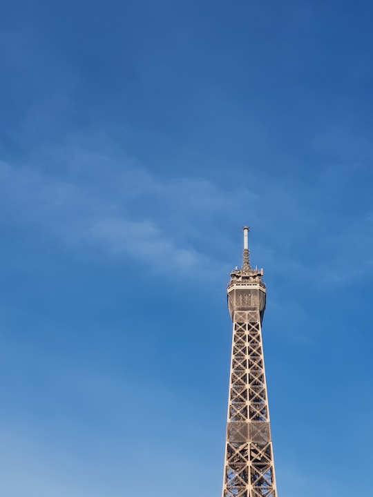 black and white tower under blue sky in Trocadéro Gardens France