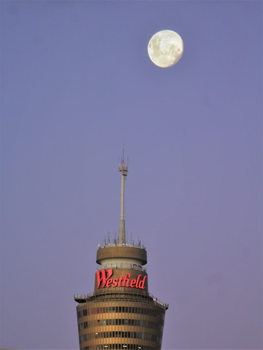 red and white tower under full moon in Sydney Tower Eye Australia