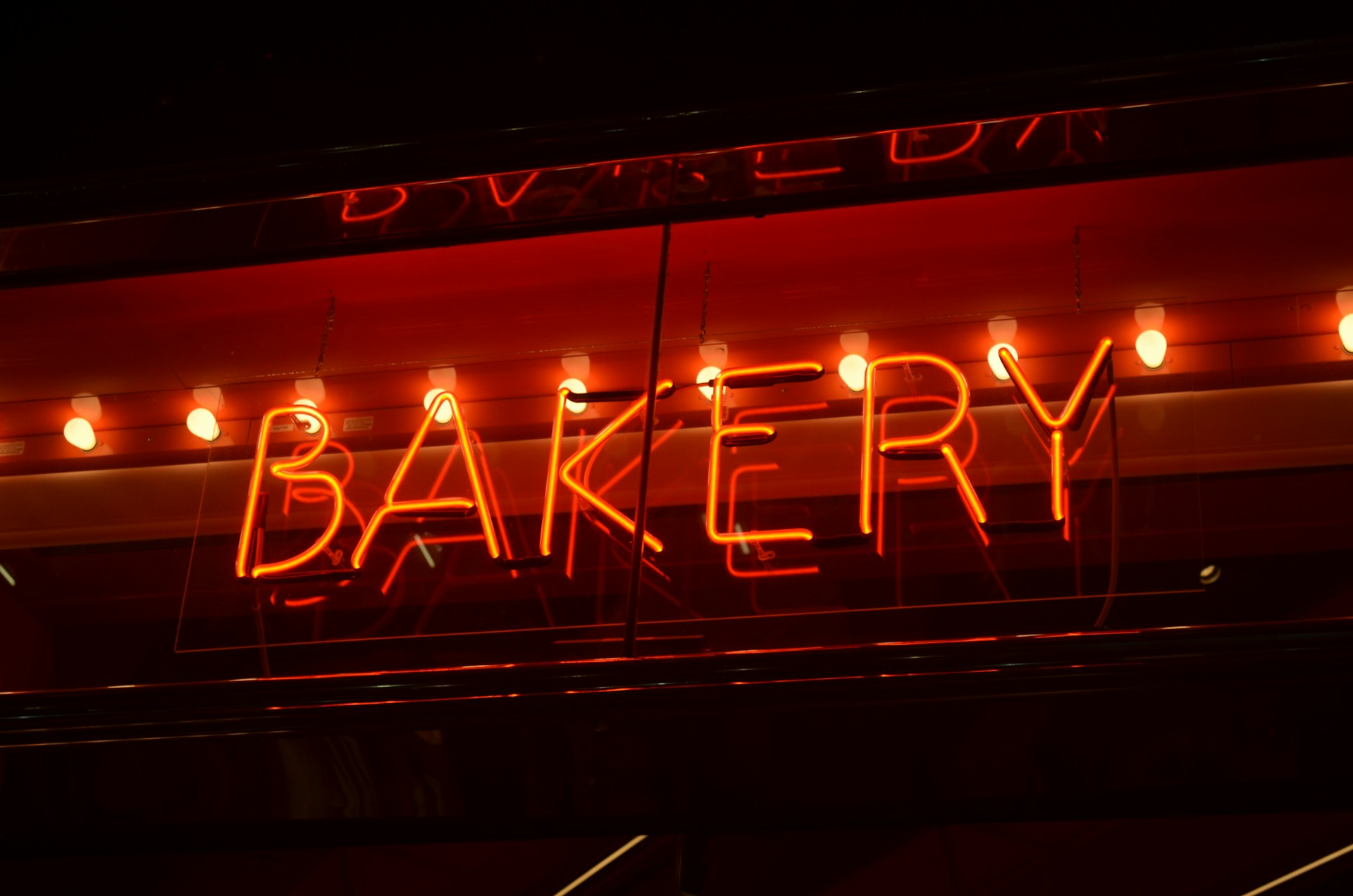 a neon sign that says bakery on it