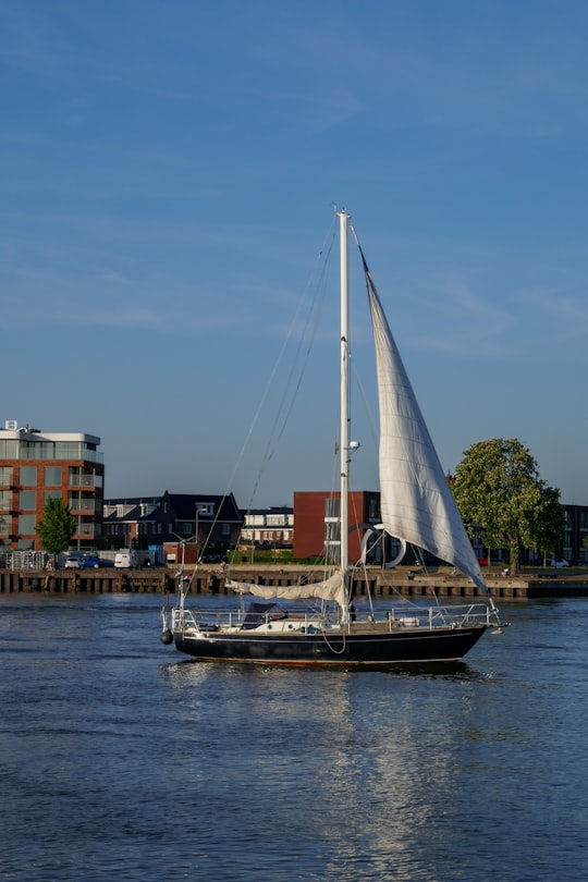 white sail boat on dock during daytime in Ridderkerk Netherlands