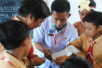 man in white button up shirt holding white smartphone