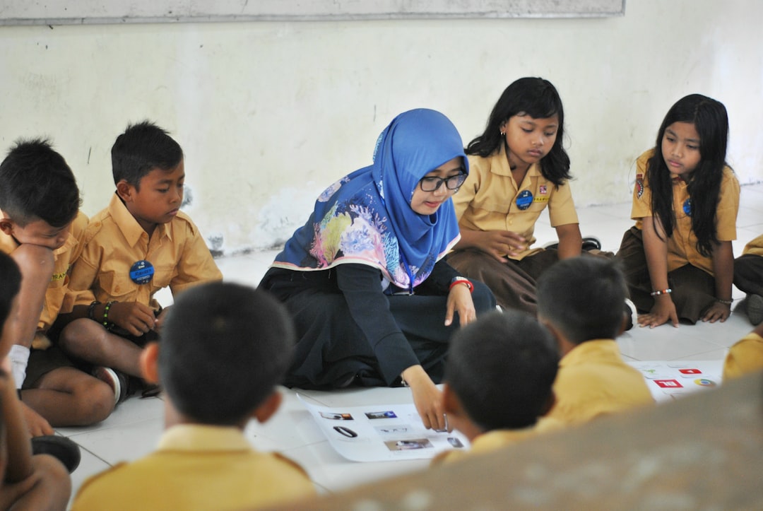 young_teacher_interacting_with_children