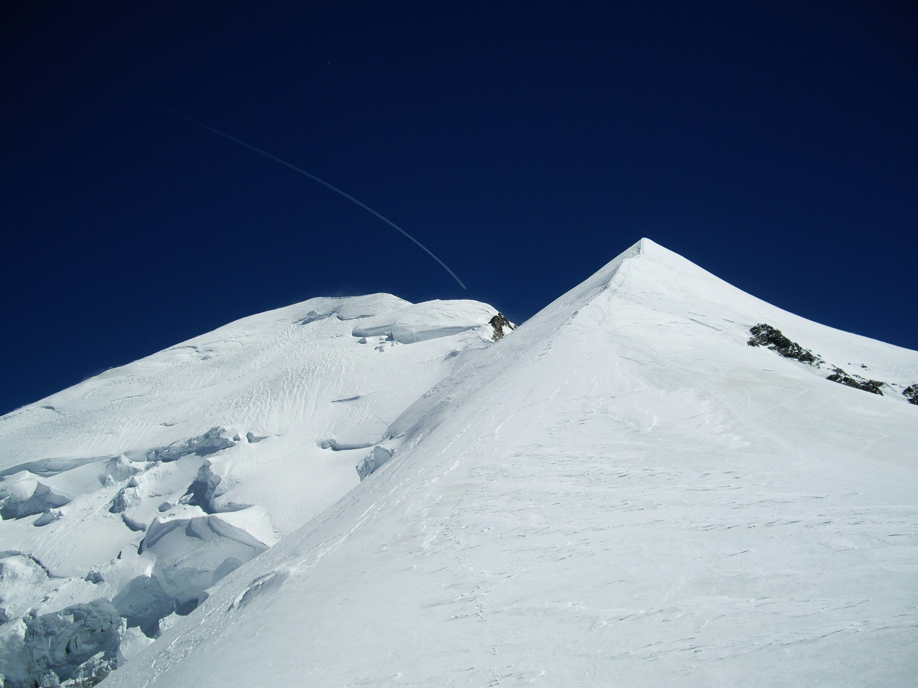 snow covered mountain under blue sky during daytime