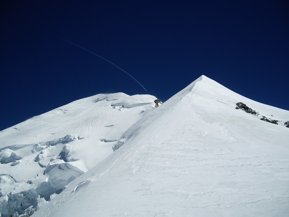 snow covered mountain under blue sky during daytime