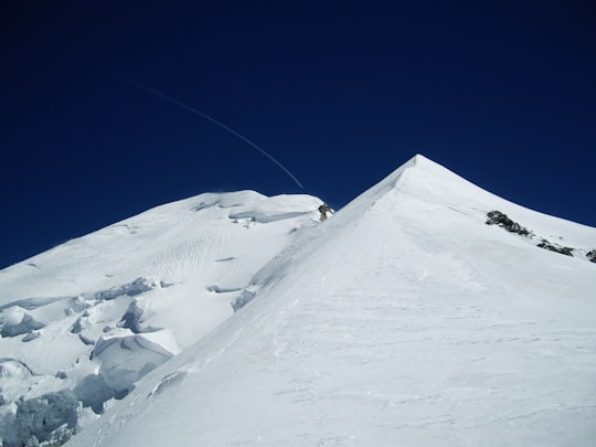 snow covered mountain under blue sky during daytime in Refuge Vallot France