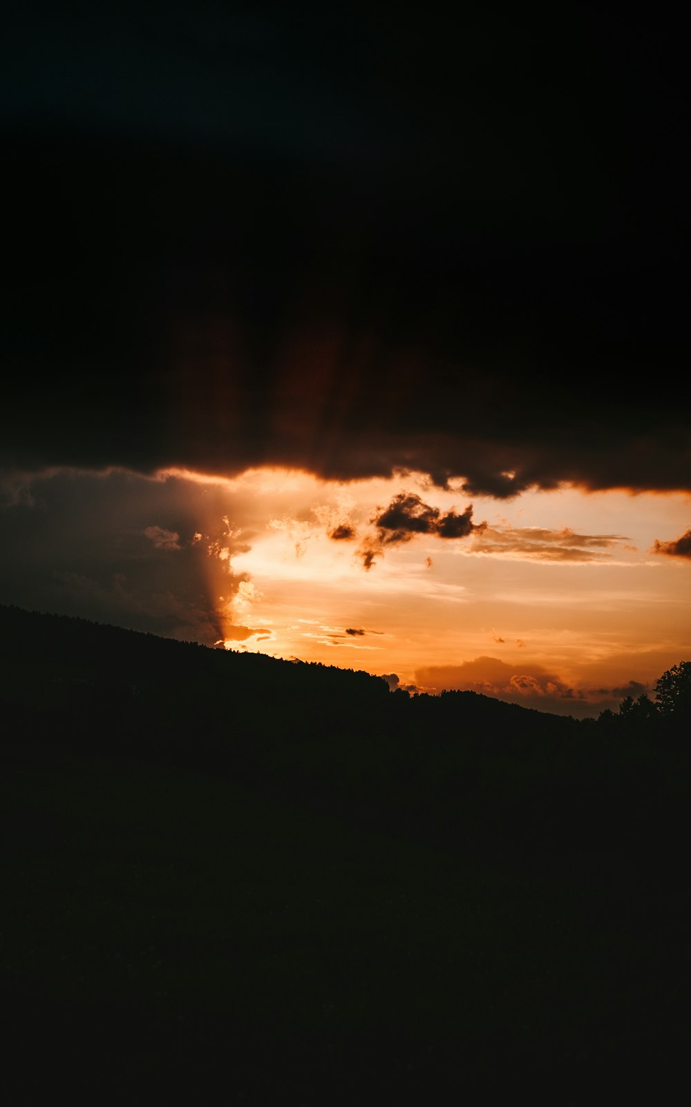 silhouette of mountain during sunset