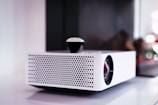 black and white projector on white table