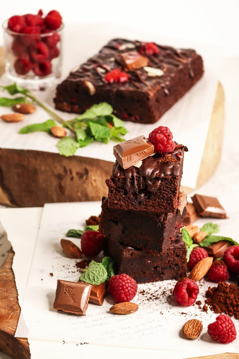 a piece of chocolate cake sitting on top of a white plate