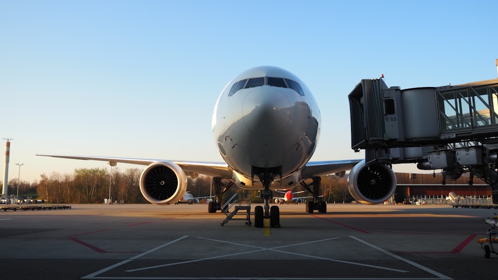 white airplane on airport during daytime