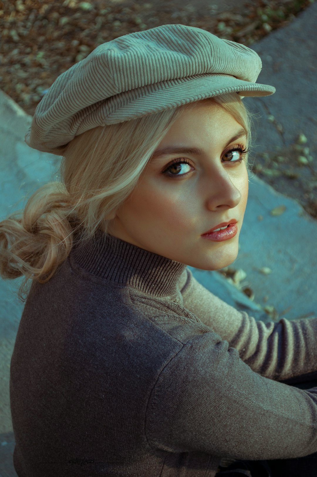 woman in black turtleneck sweater and brown sun hat