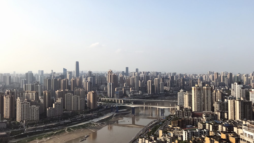 city skyline under white sky during daytime