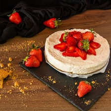 strawberry on white ceramic plate
