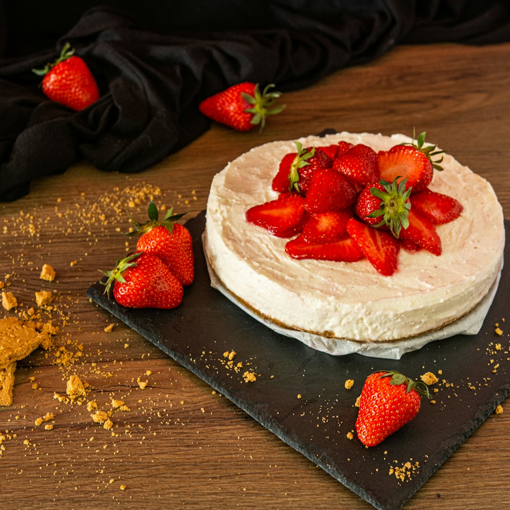 strawberry on white ceramic plate