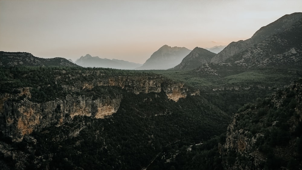 green and brown mountains under white sky during daytime