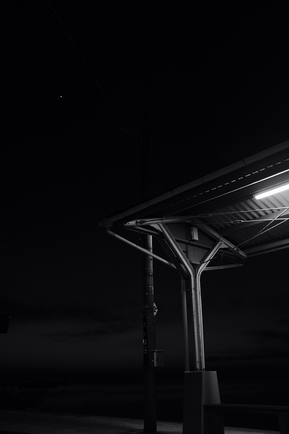 grayscale photo of a train station