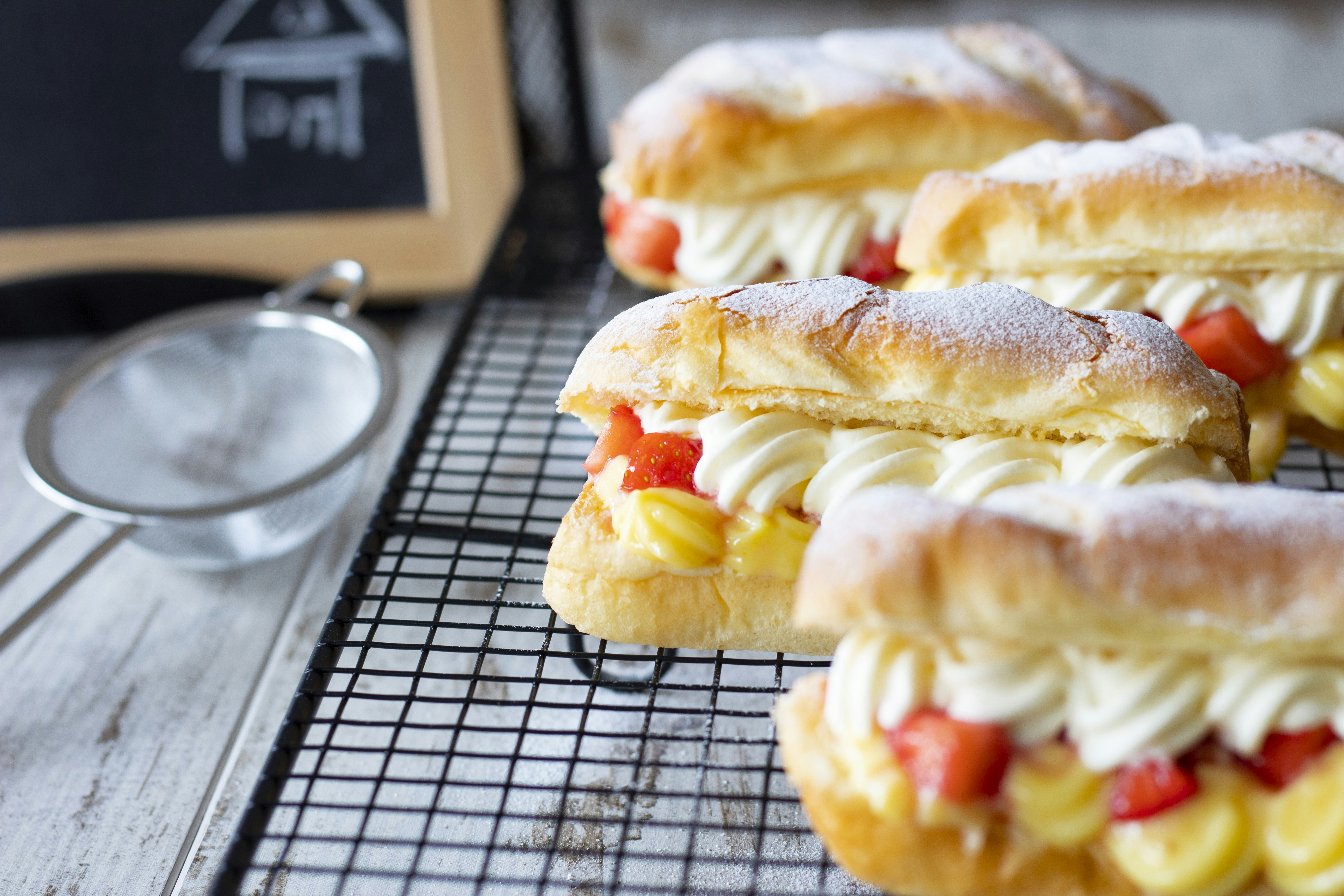 bread with cream on white paper, Cream Bun-Pastry-Home Cooking-Haarlem