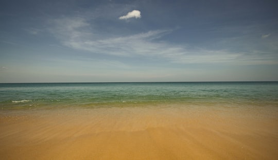 brown sand under blue sky during daytime in Phuket Thailand