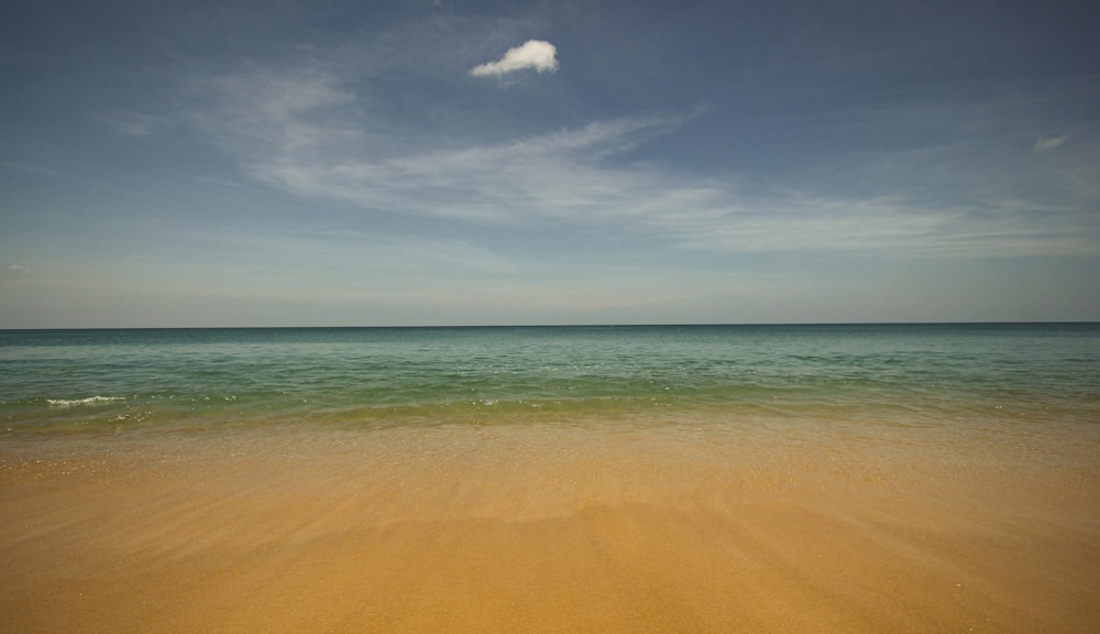 brown sand under blue sky during daytime