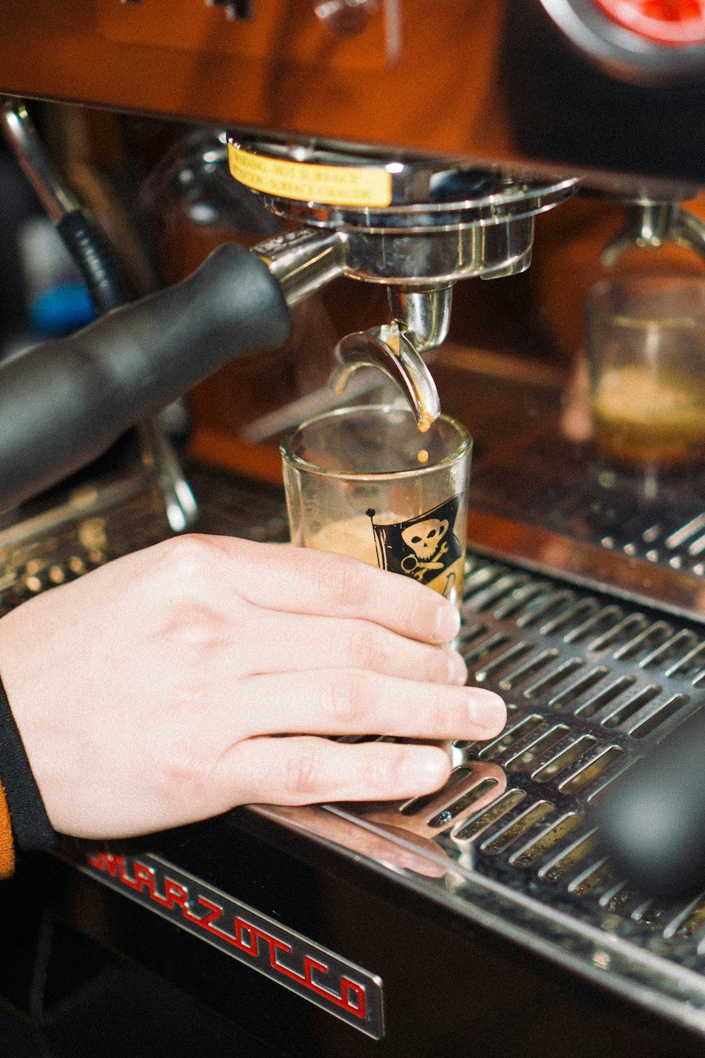 person holding clear drinking glass