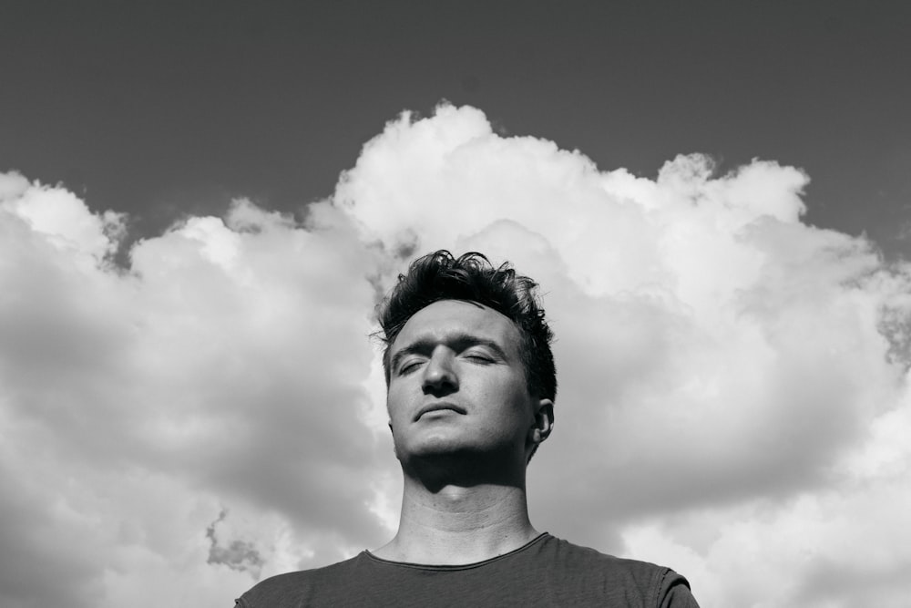 man in crew neck shirt in grayscale photography