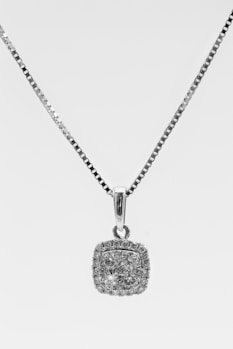 silver heart pendant necklace on white background