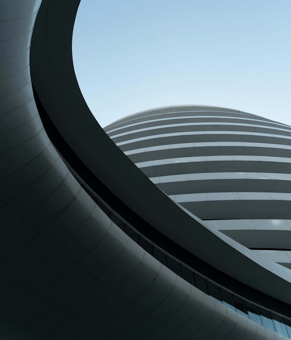 gray round building under blue sky during daytime