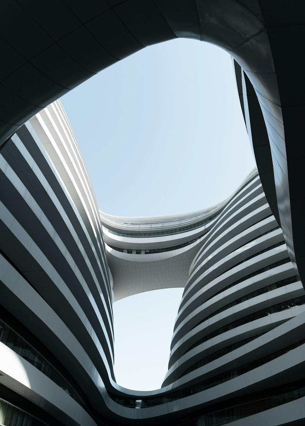 white and black concrete building under blue sky during daytime