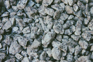 Close-up of fine crushed stone (Brita 0) piled at the quarry site.