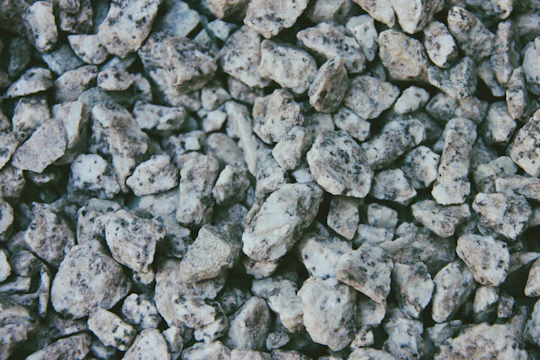 Close-up of fine crushed stone (Brita 0) piled at the quarry site.