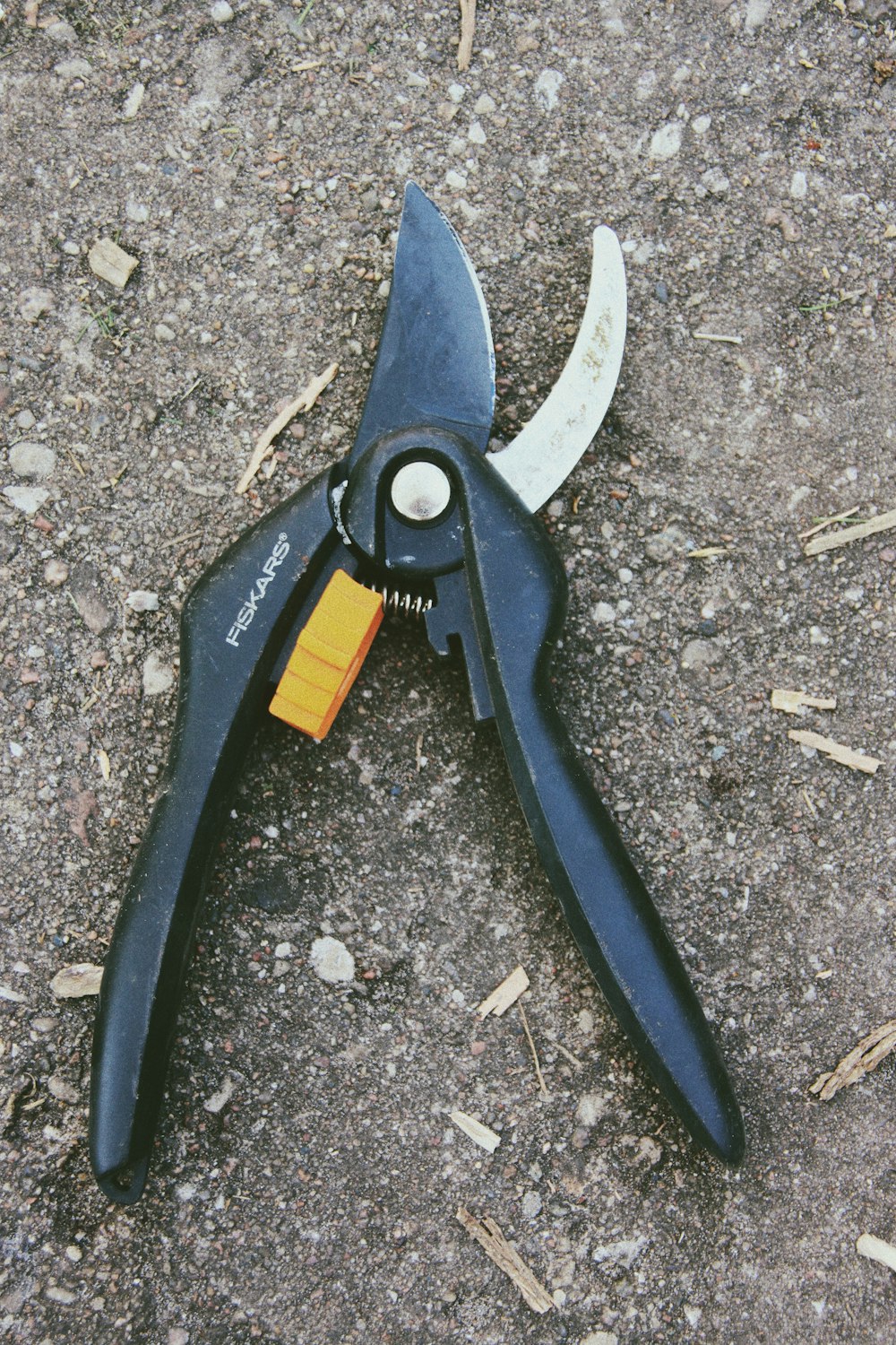 a pair of pliers is laying on the ground