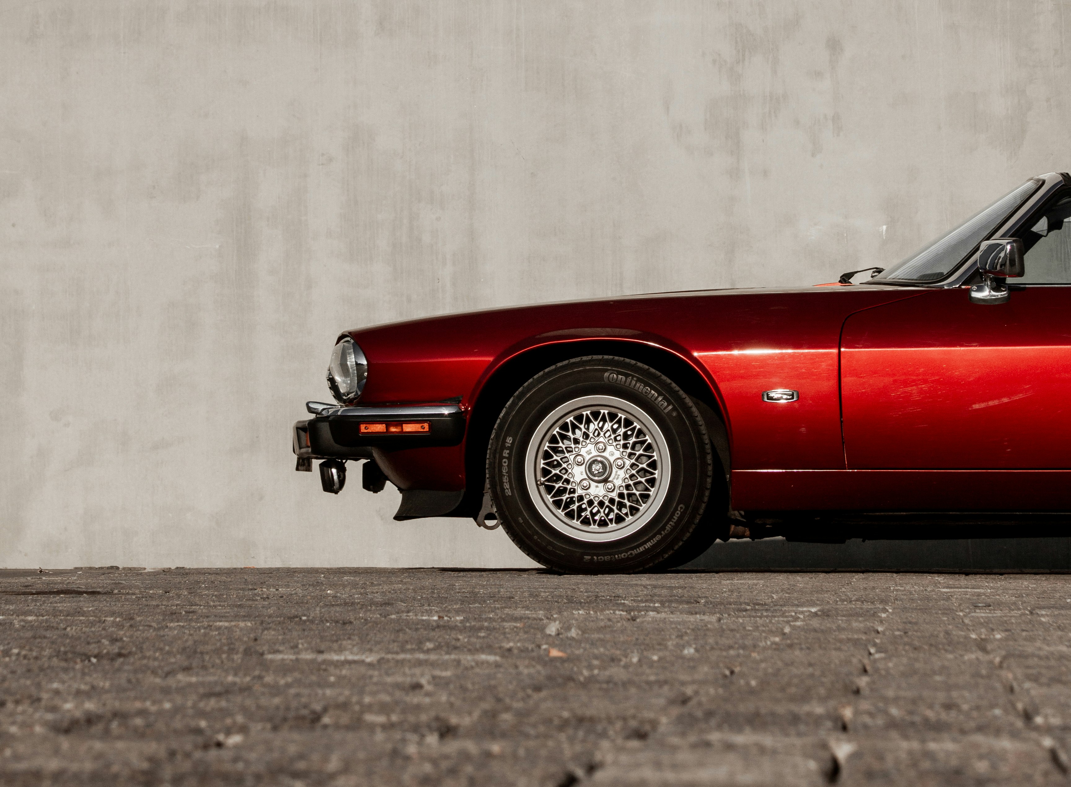 red car on gray asphalt road