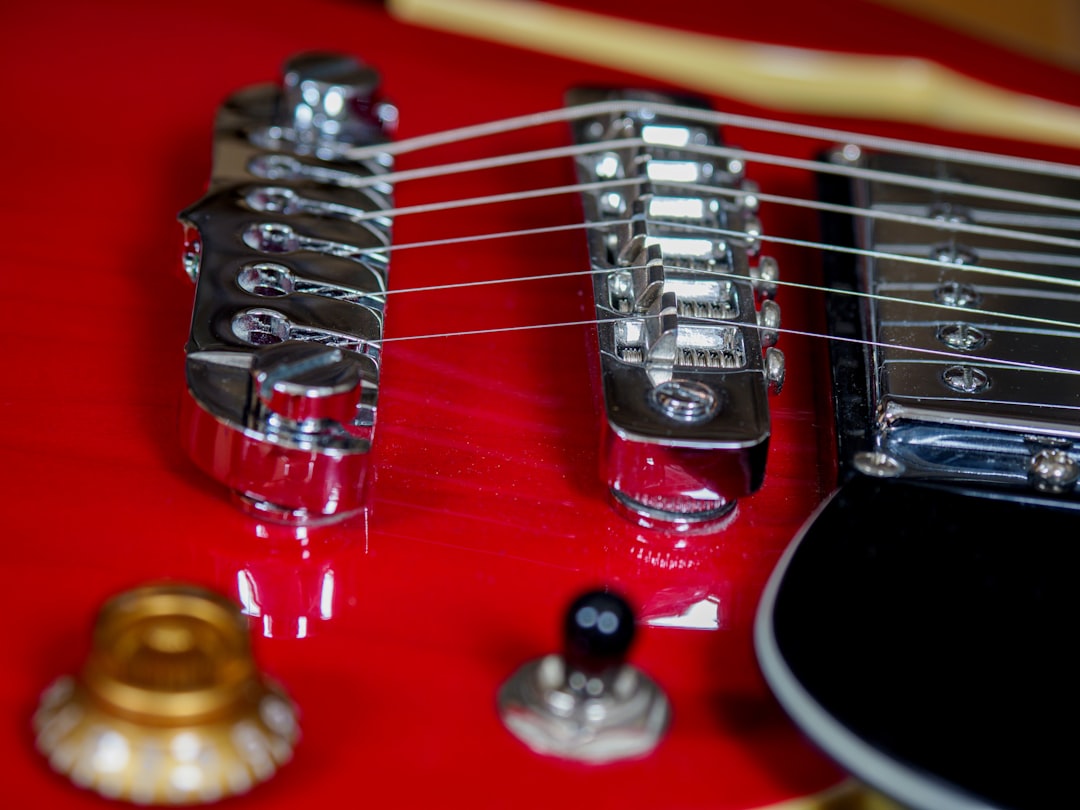 red and black electric guitar