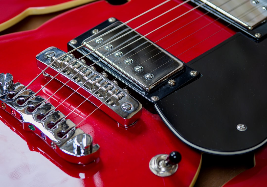 red and black electric guitar