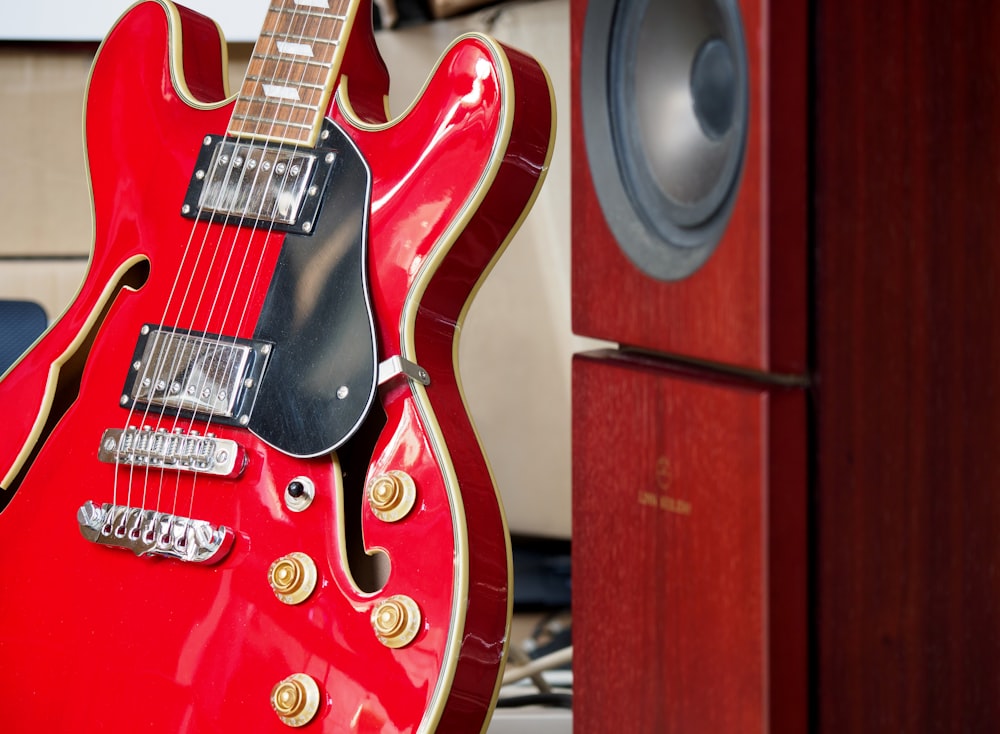 red and brown stratocaster electric guitar