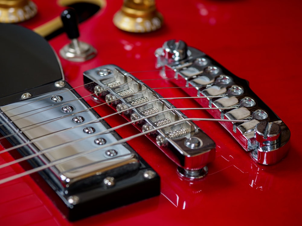 a close up of a red electric guitar