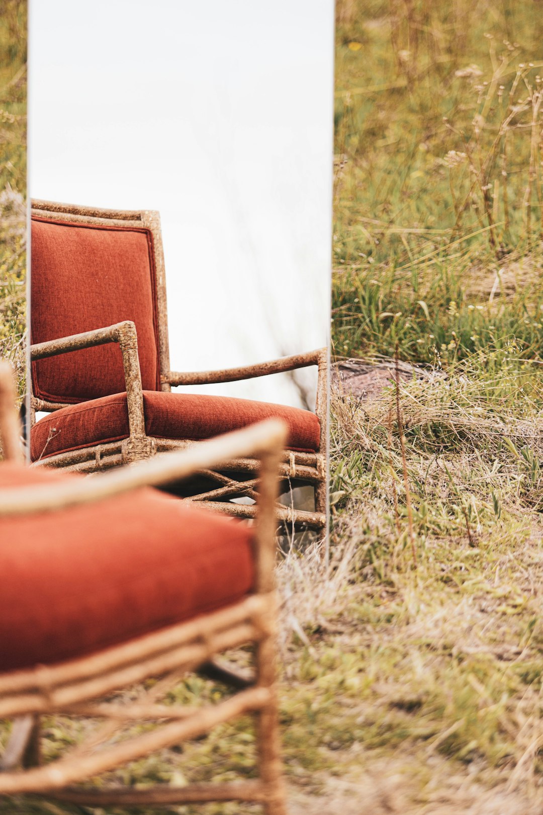 brown wooden chair on green grass field during daytime