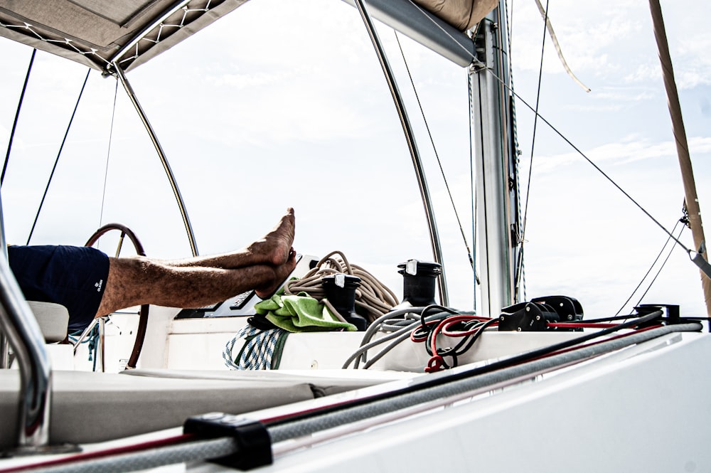 person in white boat during daytime