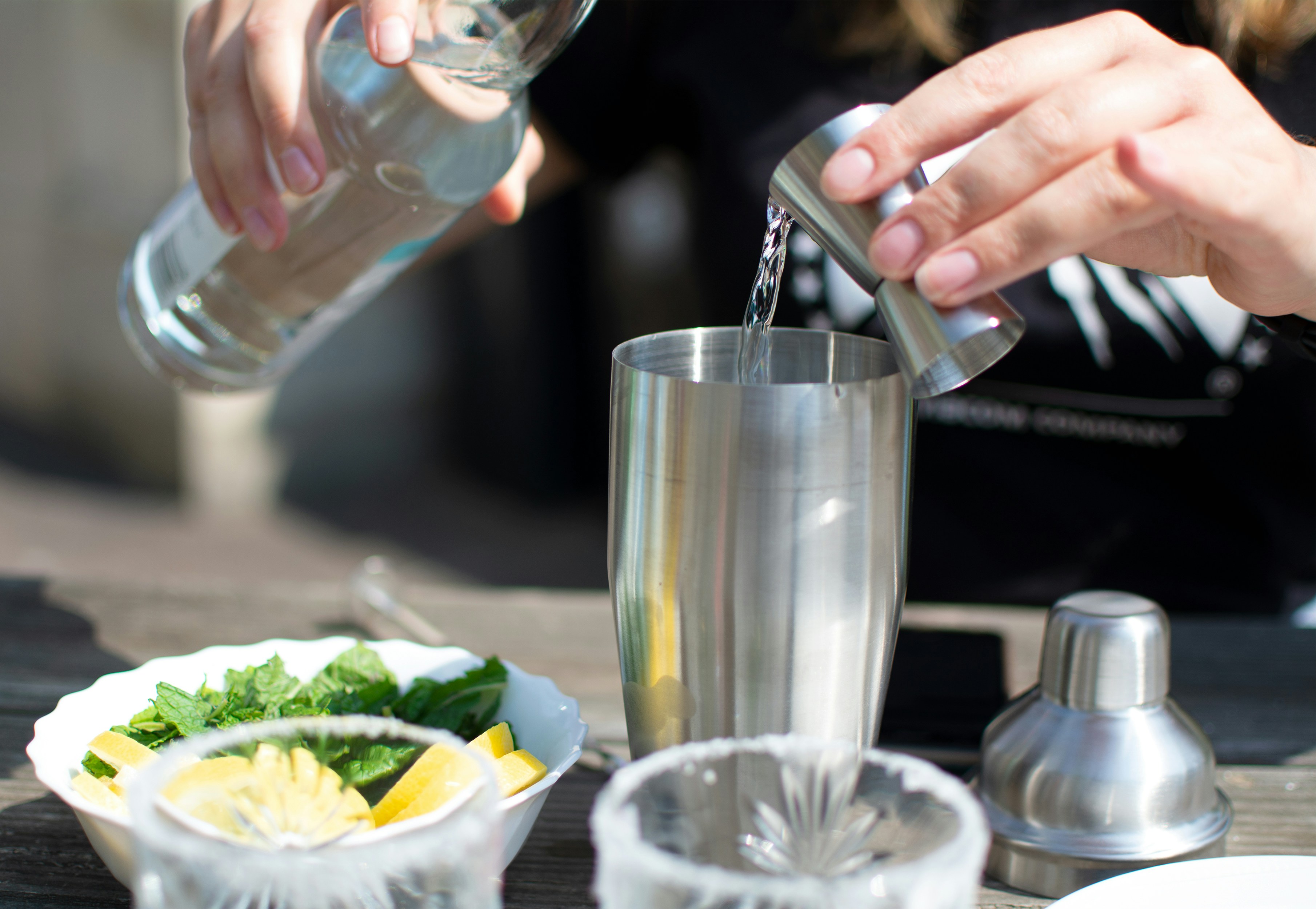 person holding clear drinking glass