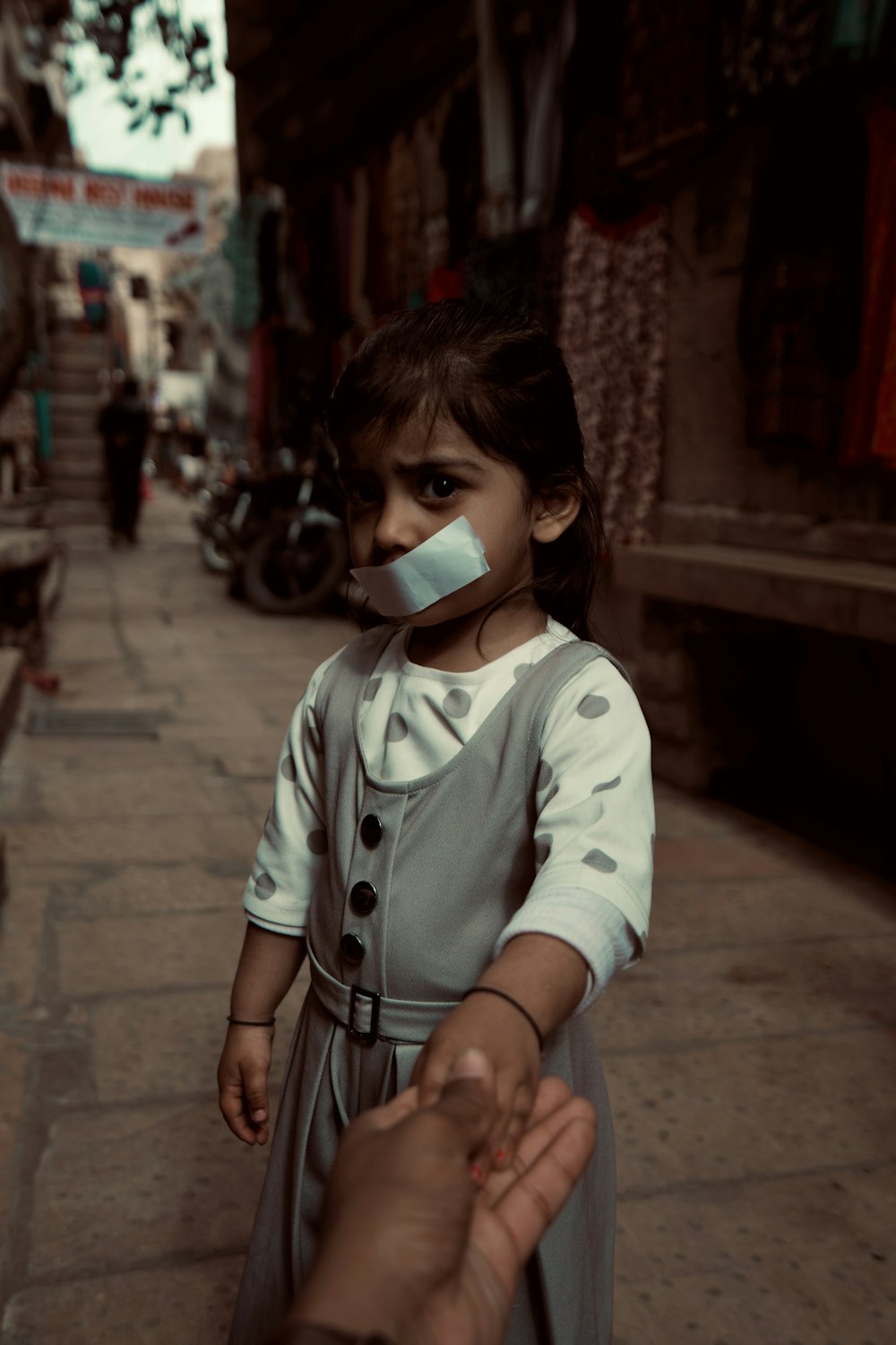 woman in white long sleeve shirt wearing white face mask