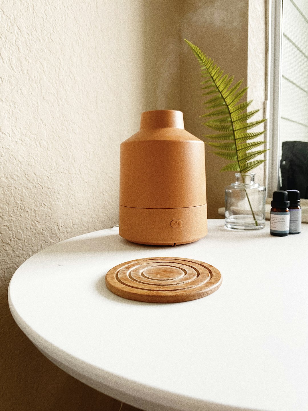 brown round container on white round table
