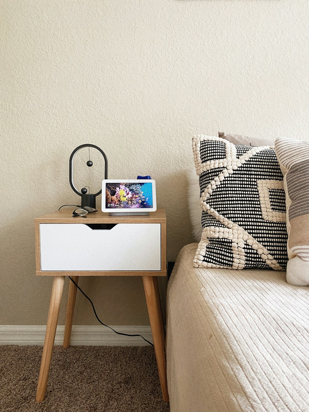 black ipad on brown wooden table