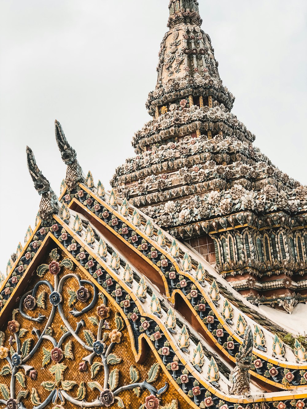 gold and brown temple under white sky during daytime