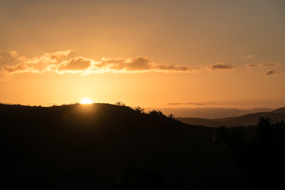 silhouette of mountain during sunset