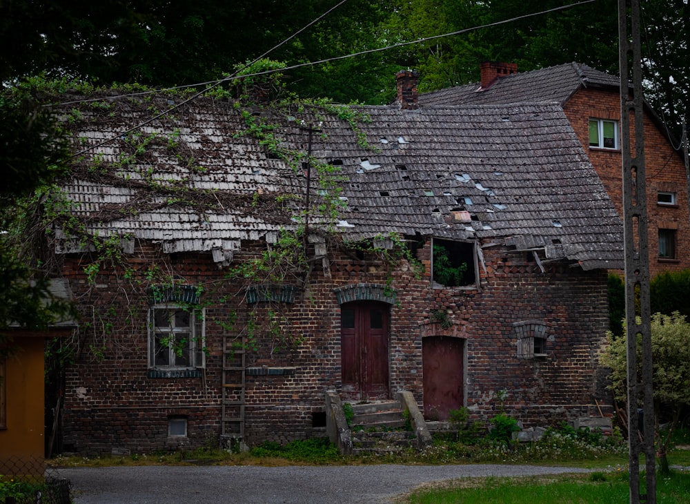 brown brick house near green trees during daytime